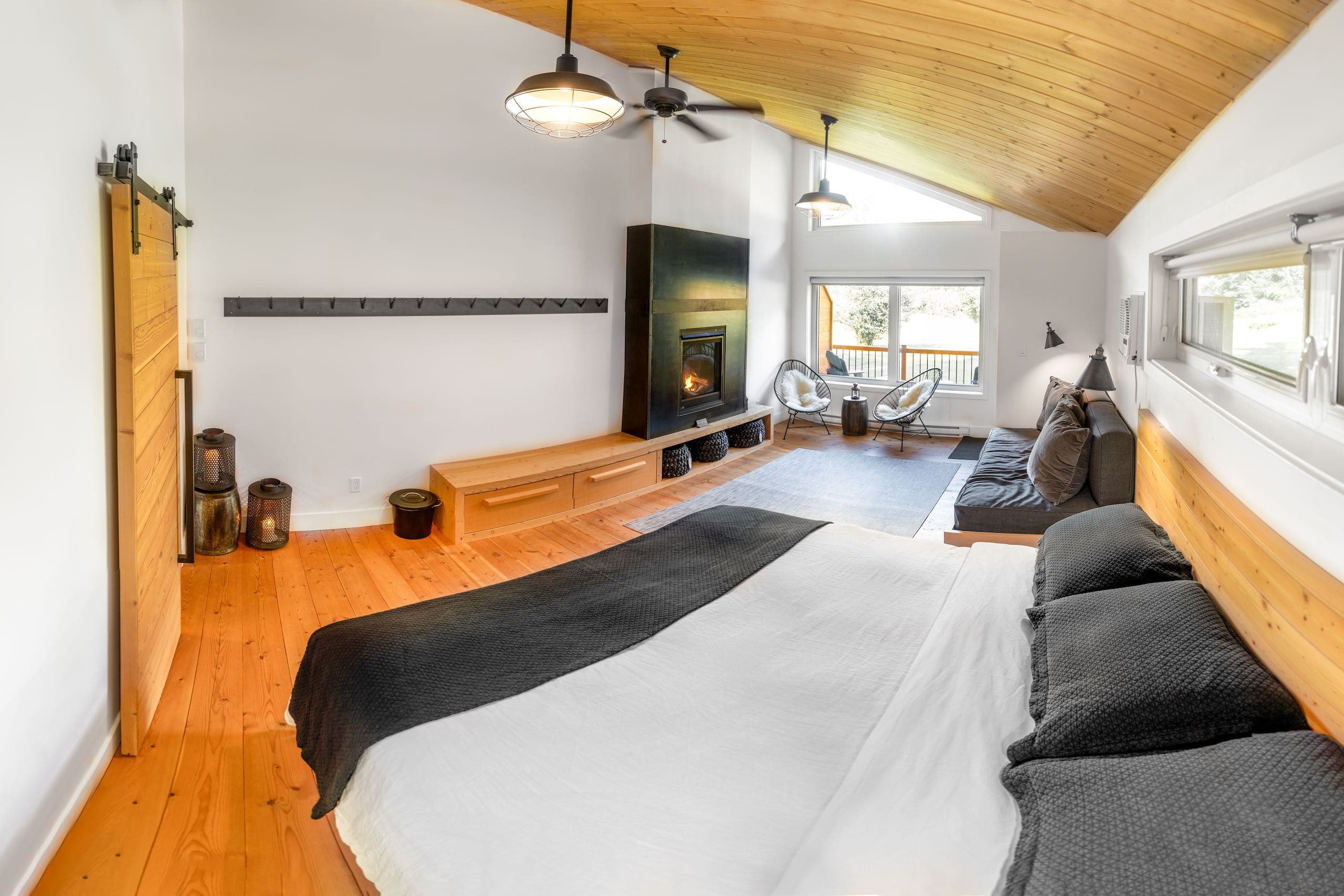 Bedroom with seating area and fireplace