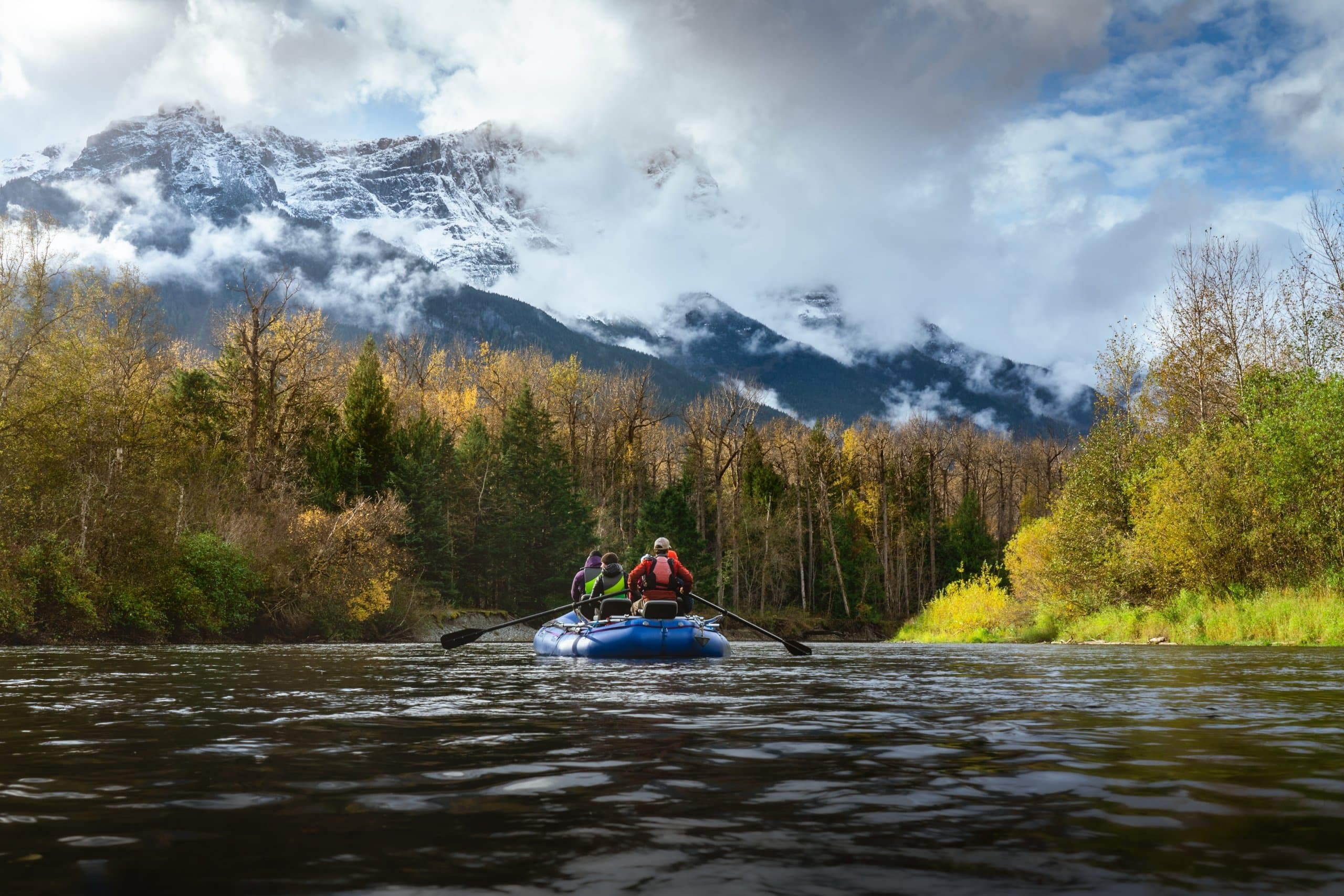 person canoeing in a river