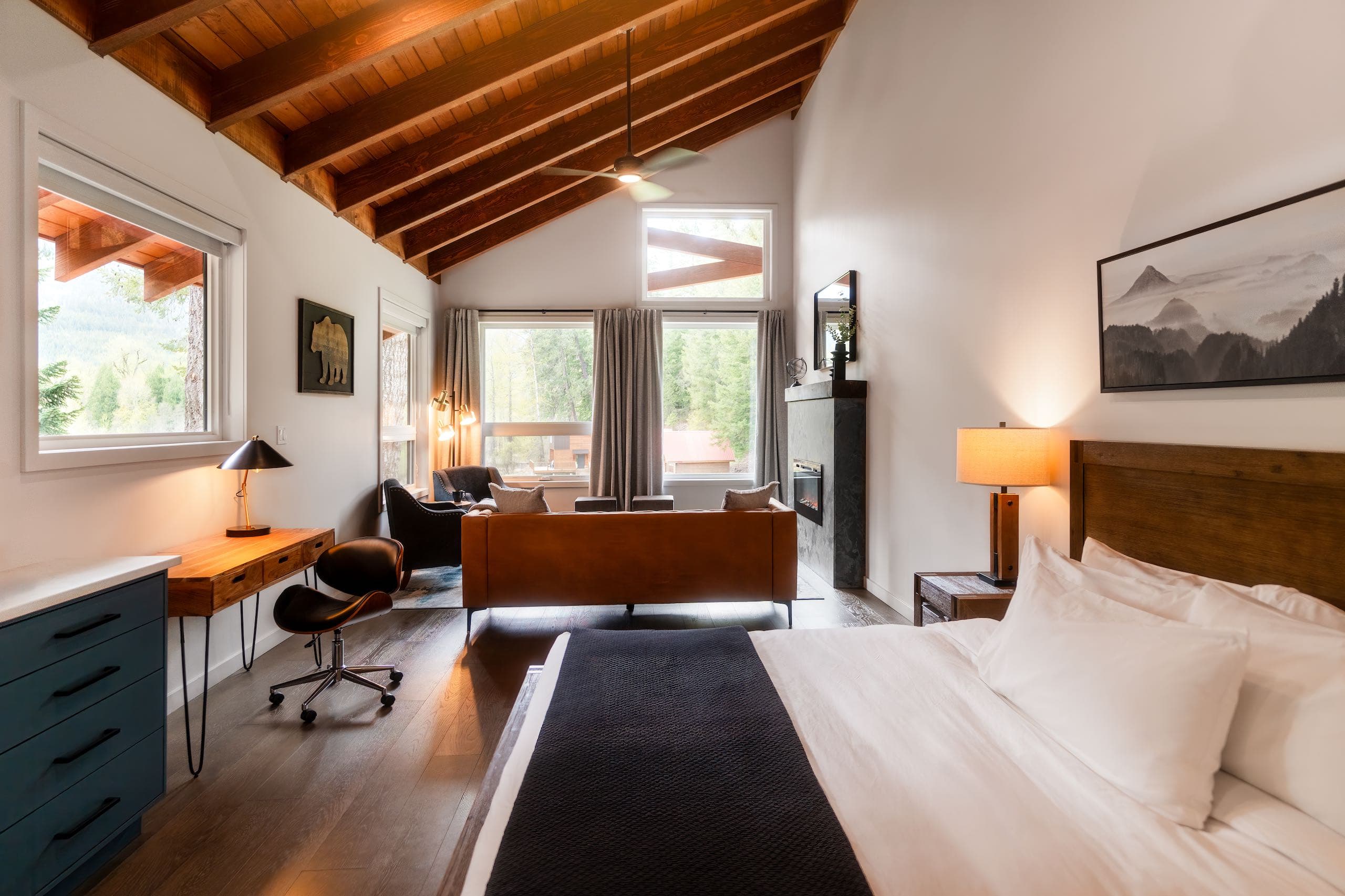 Bedroom with desk and a large seating area