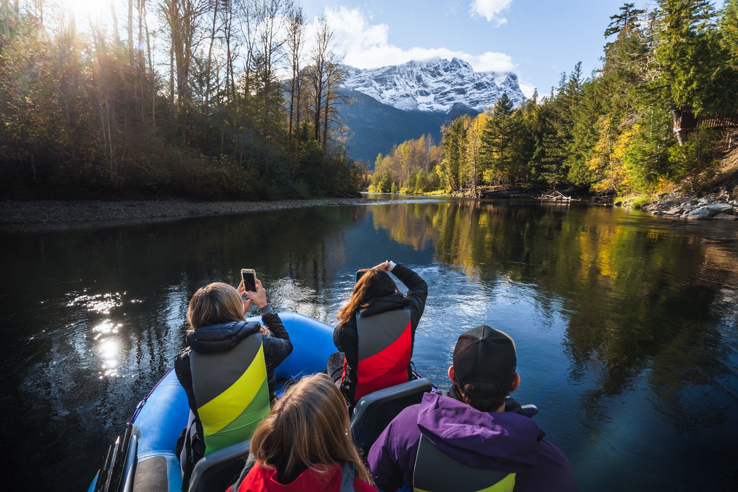 People on a river drifting and looking for bears
