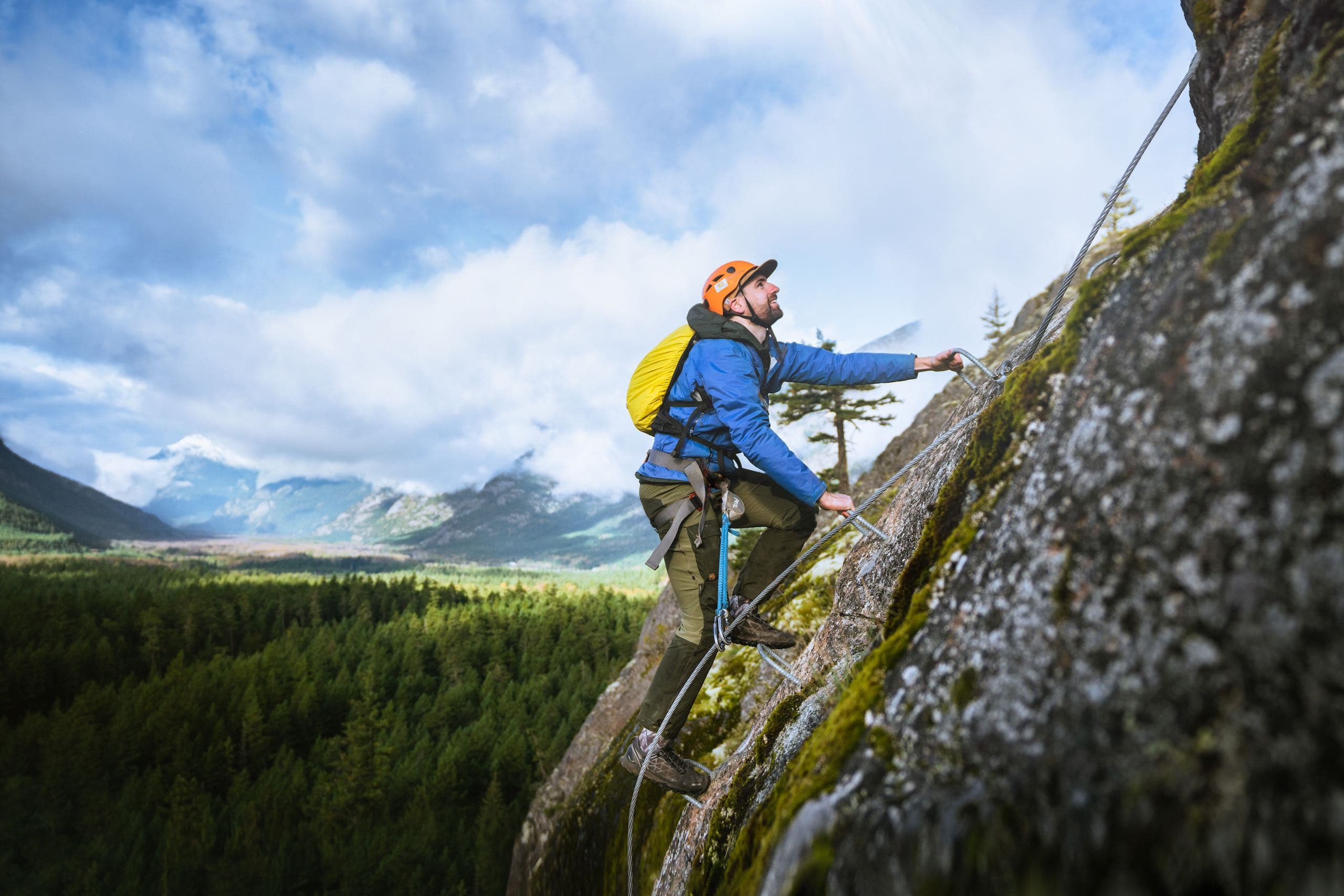 A man climbing a mountain alone